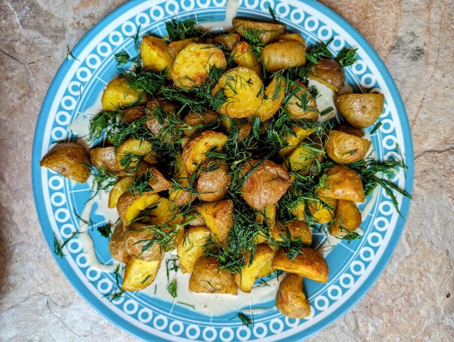 Potatoes with green sauce and tahini